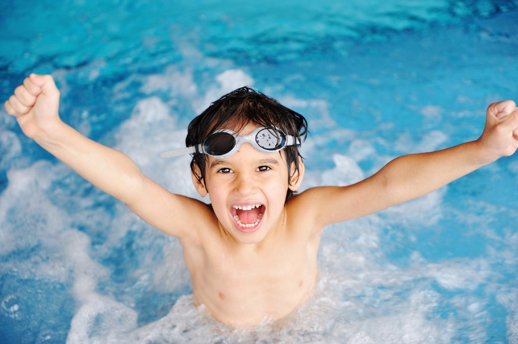 Activities on the pool, children swimming and playing in water, Photo by www.bigstockphoto.com