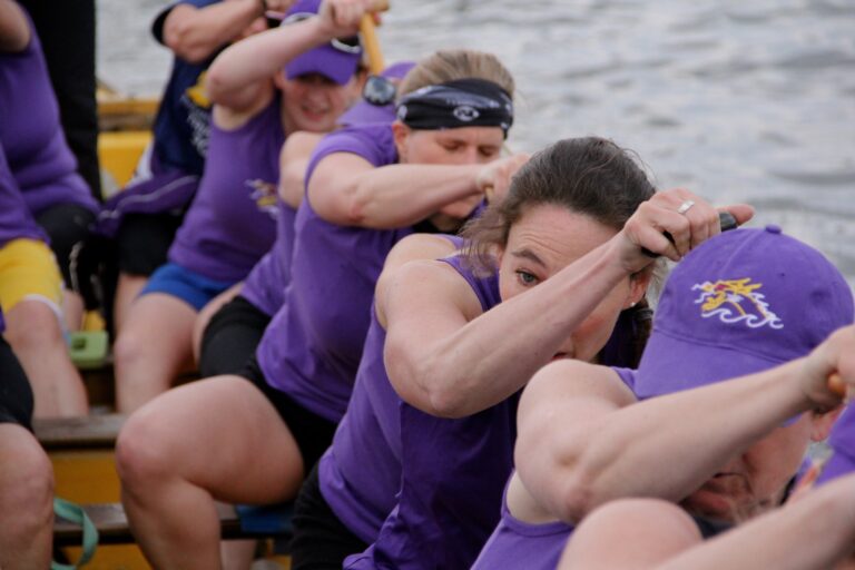 Members of the Schuylkill Dragons team work hard during a training session on the Cooper River. (Emma Lee/for NewsWorks)