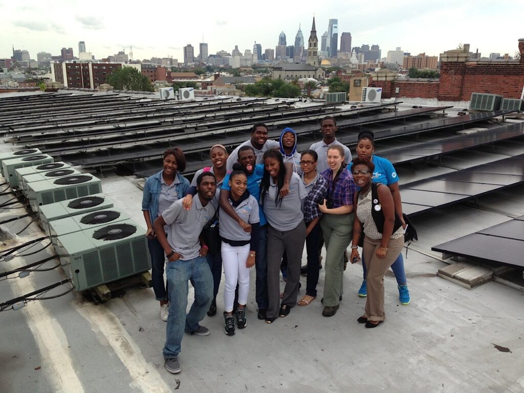philadelphia-solar-schools-initiative.original students on the roof with solar panels set up