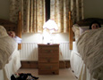 Couple in separate beds