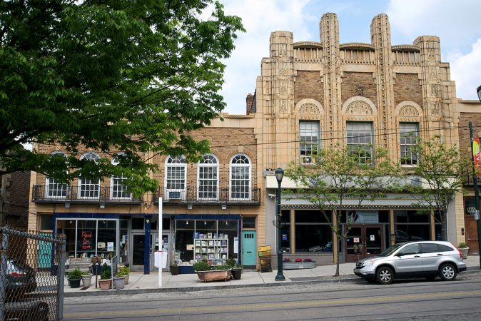 The art-deco facade of the Sedgwick theatre is seen in this view of the main commercial district of Mt Airy, situated at the 7100 block of Germantown Avenue. (Bastiaan Slabbers for WHYY)