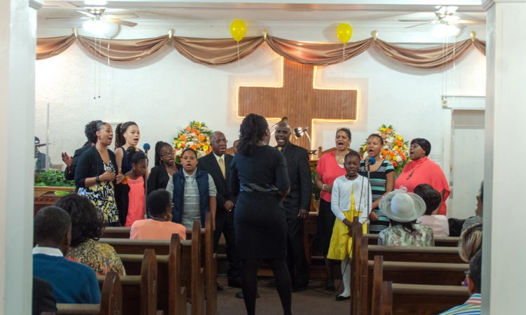 The church choir leads the congregation in song. 
