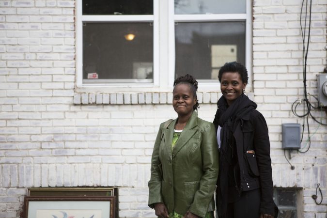 Diane Precht, right, and her mother Daisy Baptiste, right, in front of their former home on Williams Street in Jewtown. (Photo by Jessica Kourkounis)