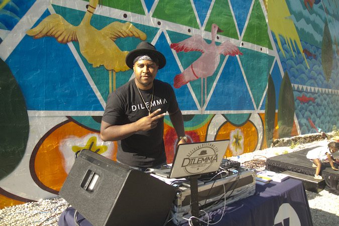 DJ Dilemma provides the soundtrack at the Storytelling Block Party. (Miguel Martinez/Every ZIP Philadelphia)