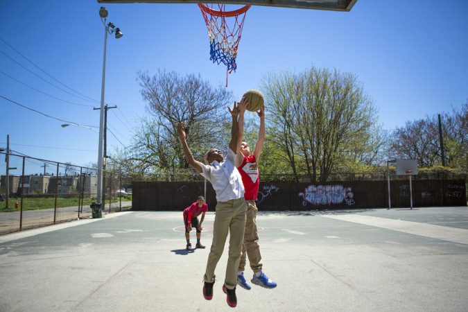 Neighborhood kids play basketball at Jewtown Park. The kids say they do not like the neighborhood because there are a lot of drugs and violence. (Photo by Jessica Kourkounis)