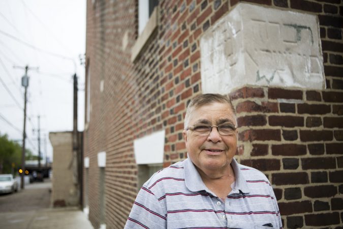 Historian and author Allen Meyers stands outside what was originally one of two synagogues located in Jewtown. There is still a cornerstone visible with Hebrew writing in what is now Disney ABA church at the corner of Tulip and Auburn Streets. Meyers co-authored the book The Jewish Community Under the Frankford El, which included a history of Jewtown and a collection of archival photographs. (Photo by Jessica Kourkounis)