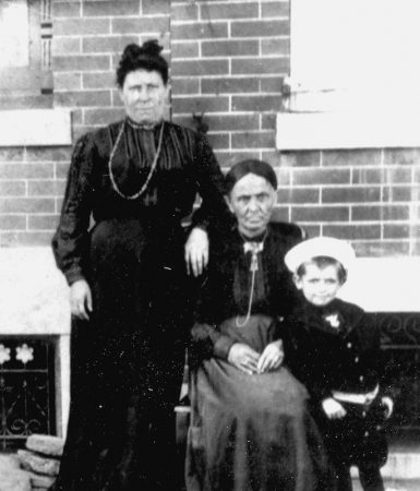 Family portraits were taken in front of homes throughout Jewtown on a regular basis. The wife of Rabbi Brenner, left, commanded the respect of the entire community, without people uttering her first name. She was affectionately addressed as rebbetzen, Yidish for 