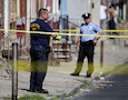 Police officers work on a crime scene