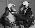 two chimpanzees in bonnets