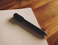 a pen and paper