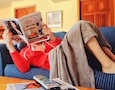 a woman sits on a couch