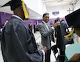 a young man prepares for his graduation