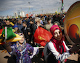 People play music and dance during the Newroz celebration