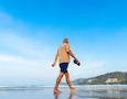 a man walks on a beach