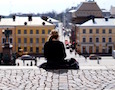 a woman sits alone