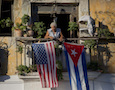 Cuban and American flags on a balcony