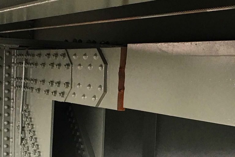 The bridge closure occurred when this steel beam completely fractured. The break is located just below the westbound right lane of I-276. (Credit: PA Turnpike Commission)