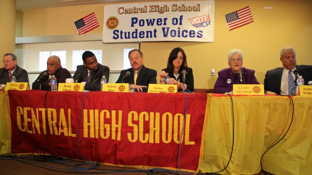1-16 Mayoral candidates (from left) Jim Kenney, Milton Street, Doug Oliver, Nelson Diaz, Melissa Murray Bailey, Lynne Abraham and Anthony Williams participate in a forum at Central High School. (Emma Lee/WHYY)