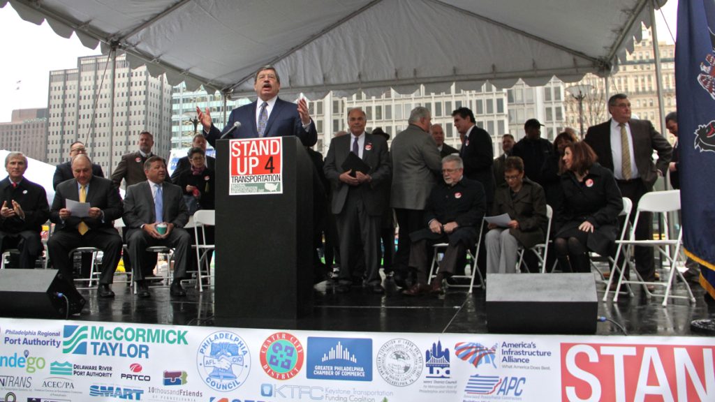 Government officials, politicians and labor leaders gather for a rally at Dilworth Park to demand federal funding for transportation infrastructure improvements. (Emma Lee/WHYY)