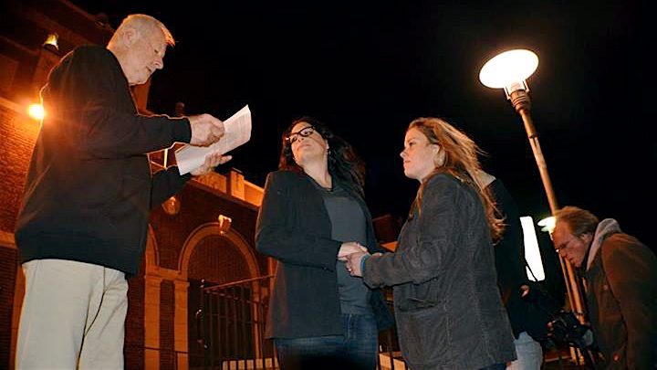 1384119_543750689037764_2133828689_n In Asbury Park early Monday, Tom Pivinski (left) officiated the marriage of Heather Jensen (center) and Amy Quinn (right). (Photo courtesy asburyparksun.com)