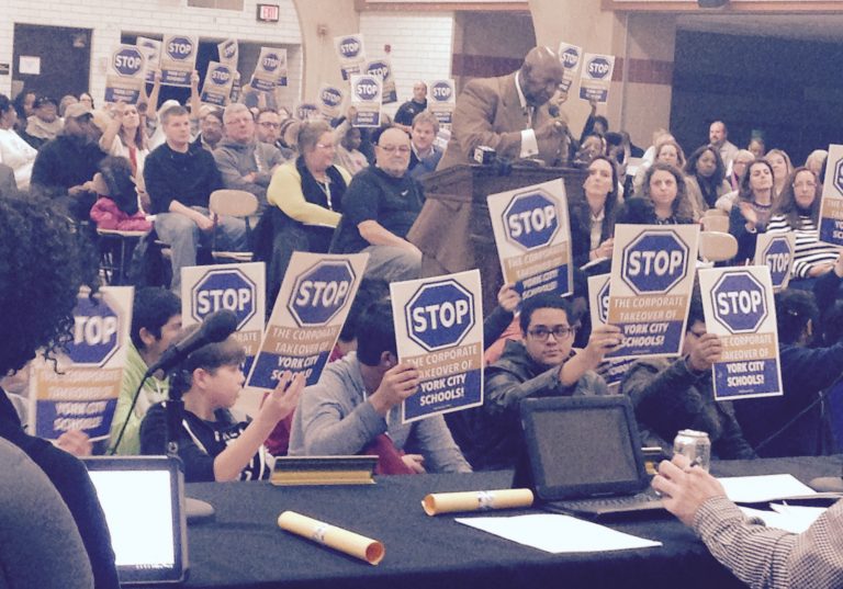  Students were among nearly 300 people who protested York City School District's charterization at a school board meeting.  (Emily Previti/WITF) 