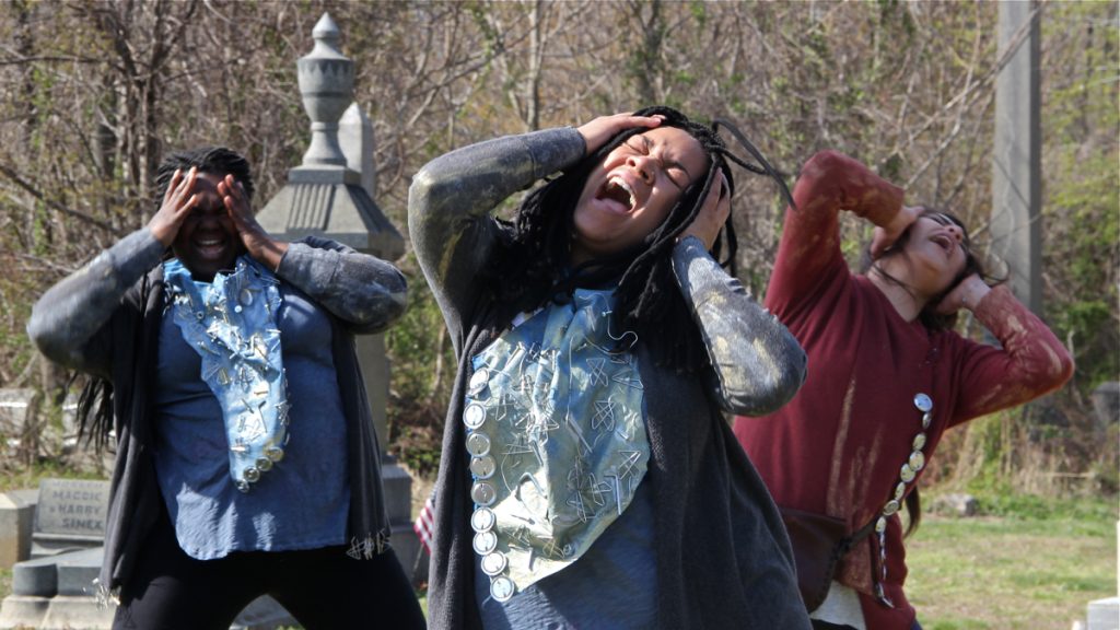 1beowulf The cast of Beowulf/Grendel (from left) Ainyé AnnaDora, Nia Benjamin, and Merri Roshoyan, rehearse in Mount Moriah Cemetery. (Emma Lee/WHYY)