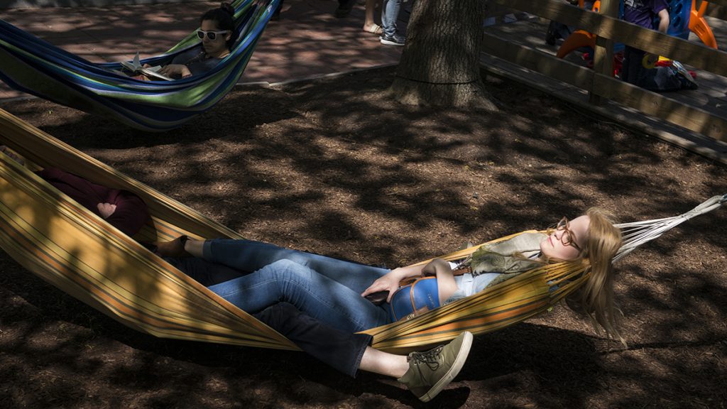 Spruce Street Harbor Park Opens to Public Elizabeth Riggio relaxes in one of the more than 50 hammocks at the Spruce Street Harbor Park. (Branden Eastwood for NewsWorks)
