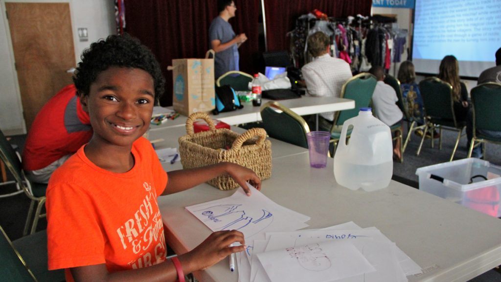 1gabe robinson lead Gabe Robinson draws while other campers at White Pines Anime Camp learn about Japanese mythology. (Emma Lee/WHYY)