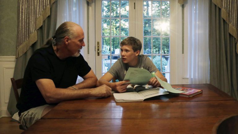 Will Richardson (left) and his son Tucker at their home in Flemington, N.J. Tucker's parents, Wendy and Will, are part of a small but growing number of parents nationwide who are ensuring their children do not participate in standardized testing.  (AP Photo/Mel Evans) 