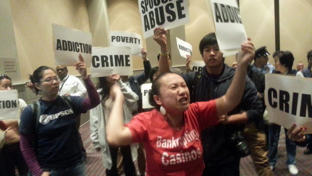 20130924_113209 Protestors demonstrate at Tuesday's hearing on casino licensing in Philadelphia. (Tom MacDonald/WHYY)