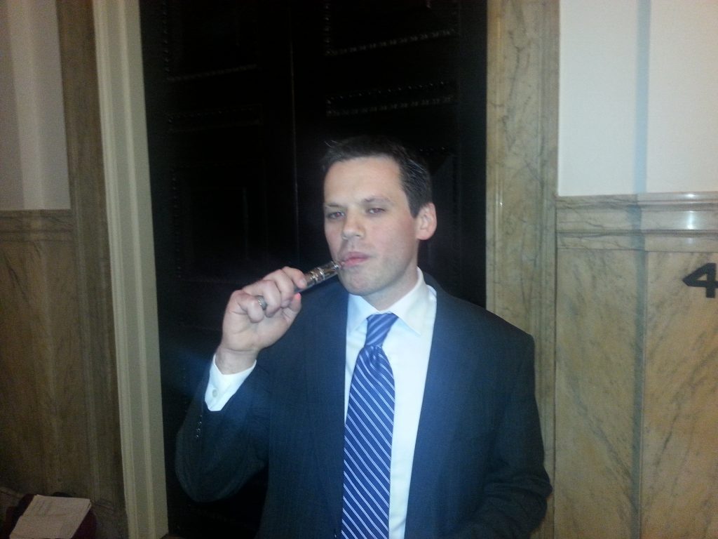  Greg Conley vaporizes with his e-cig after giving testimony in Philadelphia City Hall on Thursday, Mar. 27, 2014 (Tom MacDonald/WHYY) 