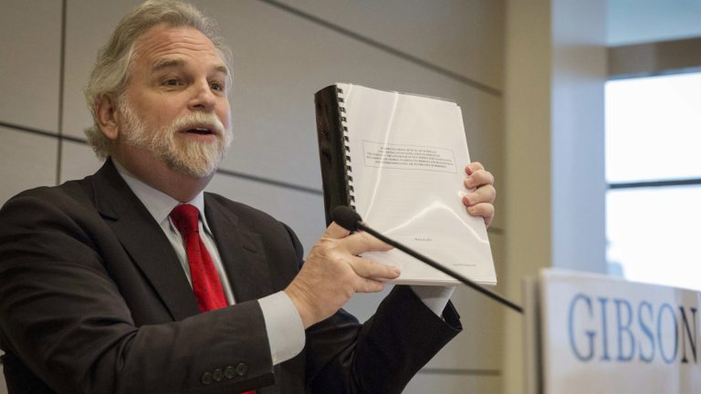  Randy Mastro holds up a copy of his report during a news conference Thursday, March 27, 2014. (AP Photo/Brendan McDermid, Pool) 