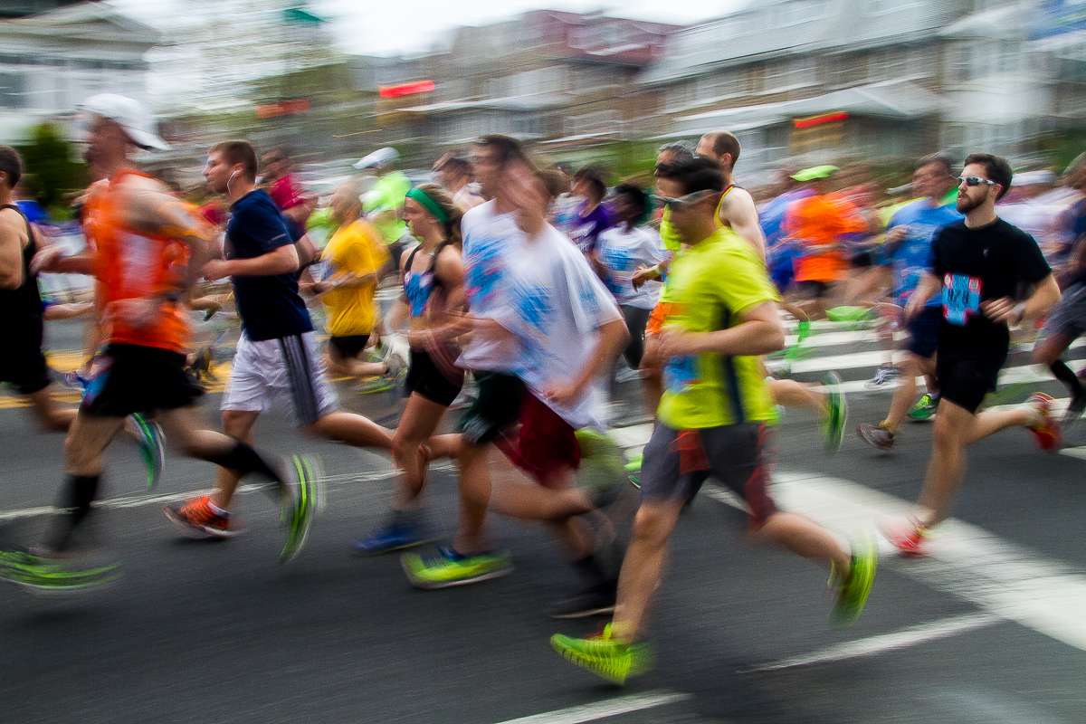  Runners make their way down North Broad Street during the 2014 Broad Street Run. (Brad Larrison/for NewsWorks) 