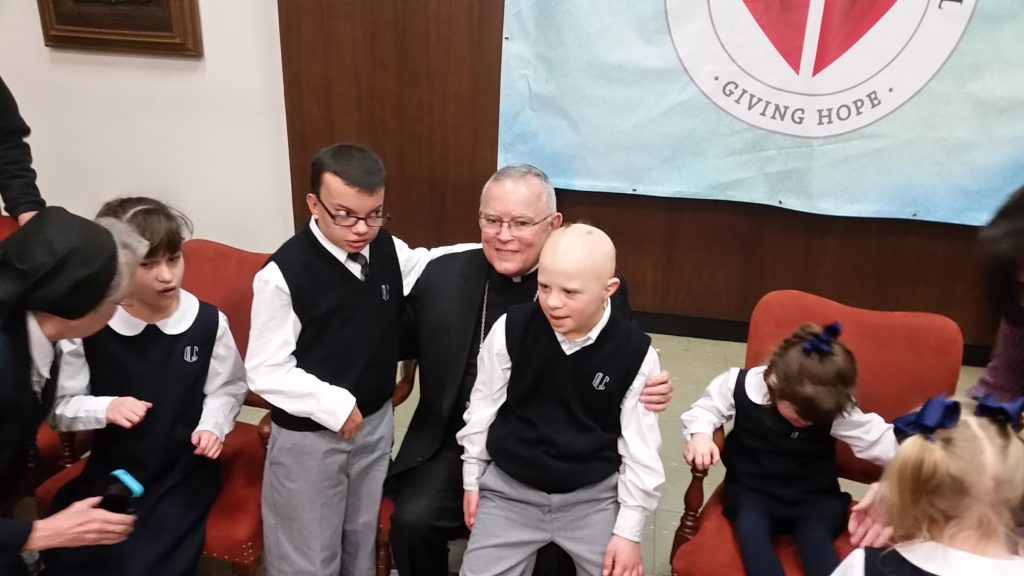 20150120_142305 Philadelphia Archbishop Charles Chaput and special-needs children at Catholic Charities announcement. (Tom MacDonald/WHYY)