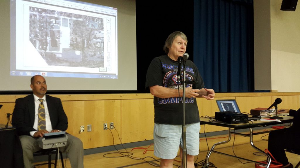  With the plan in the background, one East Norriton defends a proposed plan for a women's shelter on Keenwood Road. (Laura Benshoff/WHYY) 