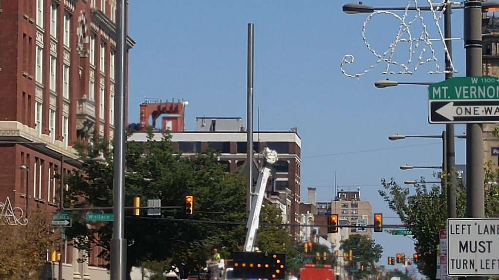  Lighting fixtures go up along North Board Street. (Tom MacDonald/WHYY) 