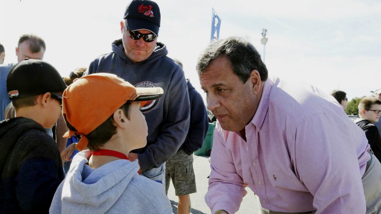 Chris Christie shakes hands with NASCAR fans at the New Hampshire Motor Speedway in September in Loudon