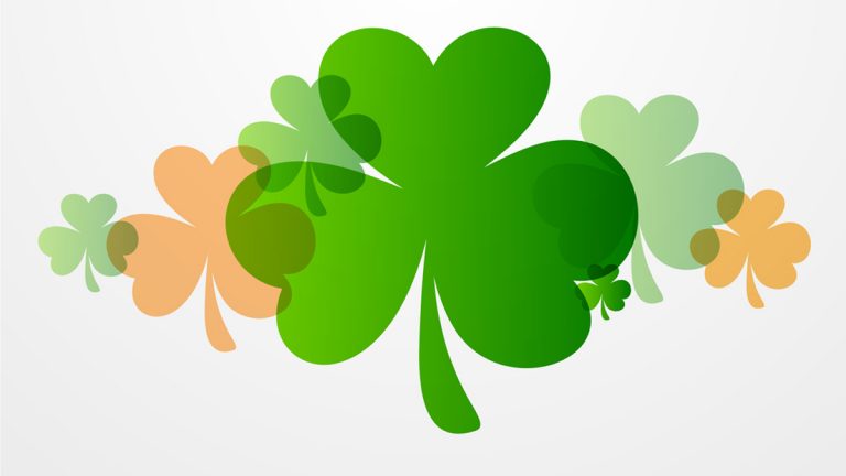 Happy St. Patrick's Day celebration background with clover leaves.