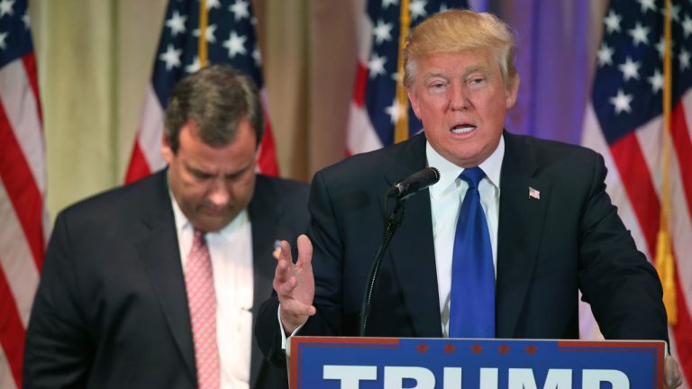 Chris Christie listens as Donald Trump speaks on Super Tuesday primary election night.  (AP Photo/Andrew Harnik)