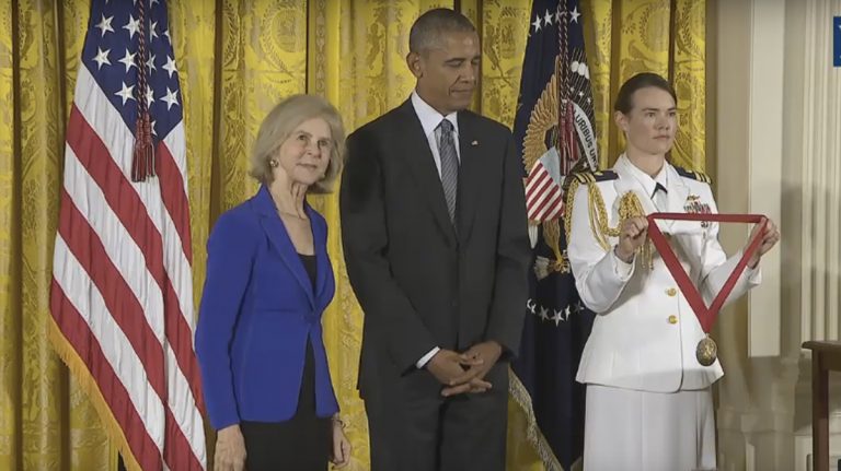Elaine Pagels (left) about to receive a National Humanities Medal from President Obama (center) (Image  from WhiteHouse.gov)