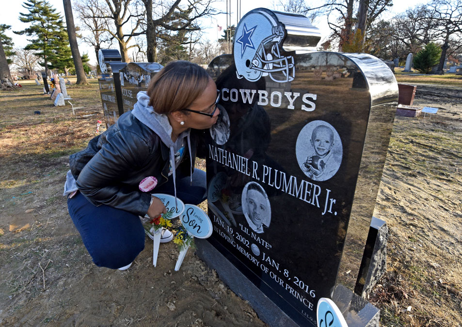 20161208sewing2 At Harleigh Cemetery, Taisha Mercado kisses the headstone of her murdered son, Nate Plummer, Jr., on January 13. (April Saul / Newsworks)