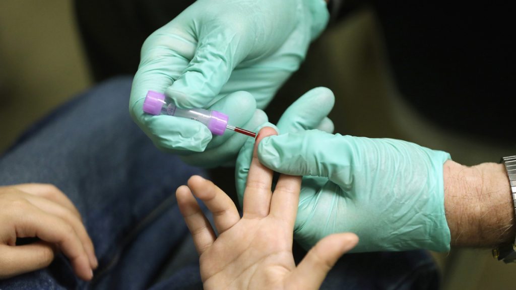 Lead Testing Michigan A child is tested for lead poisoning. New Jersey lawmakers are considering a constitutional amendment to guarantee a portion of the sales tax on paint sales in the state goes toward its lead abatement efforts. (AP file photo)