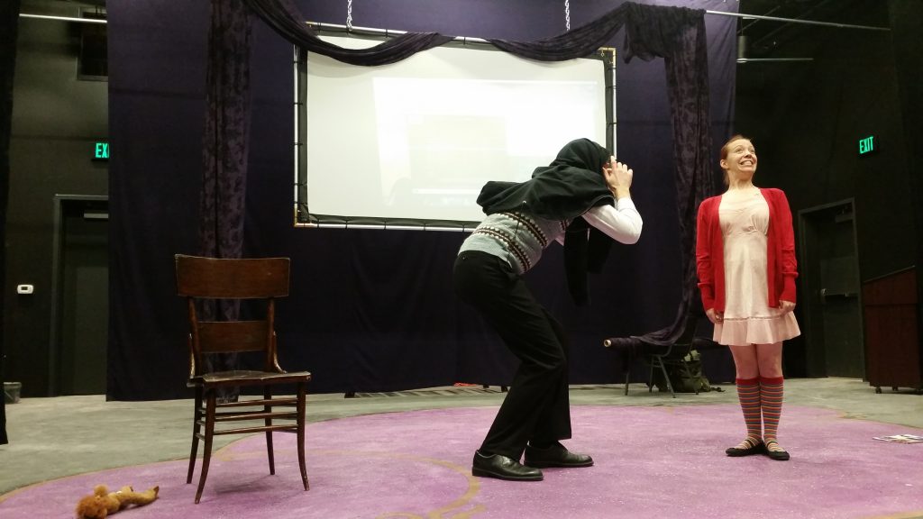 Amanda Schoonover and costar Anthony Crosby, of Simpatico Theatre Project, rehearse The It Girl at the Drake Theater's black box space. (Peter Crimmins/WHYY)