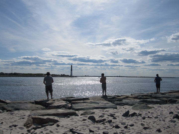  Fishermen cast from Island Beach State Park's Barnegat Inlet jetty in 2010. (Photo: Jennifer Harker/JMA Creations) 