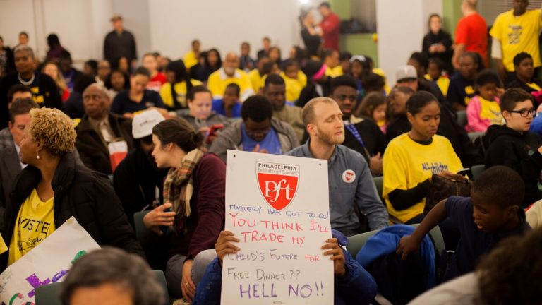  Advocates for and against converting three neighborhood schools to charters packed district headquarters Thursday night. (Photo by Brad Larrison for Newsworks) 