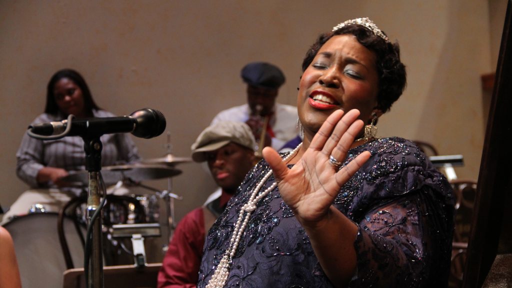 3lead Rutgers Camden alumna Dionne Grooms-Fields belts out 'Goin' Crazy with the Blues' during rehearsal at the Walter K. Gordon Theater. (Emma Lee/WHYY)