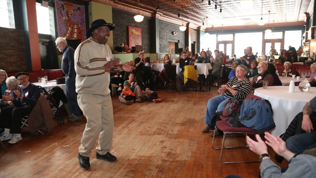 5 John Colgan-Davis of the Dukes of Destiny singing a folk song to the beat of audience claps (Natavan Werbock/for NewsWorks)