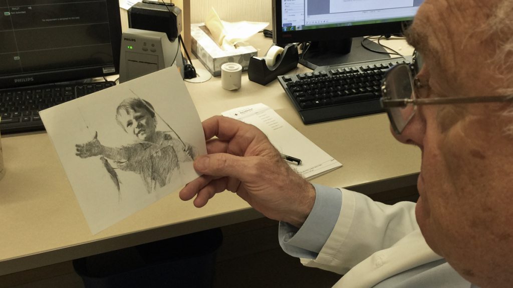 50yearslater Michael LaCombe holds the card he received from a patient he treated 50 years ago. (Courtesy of Michael LaCombe)