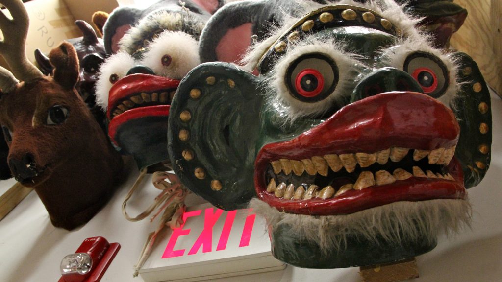 6 lead In the showroom, many elaborate masks hang from the walls. (Emma Lee/WHYY)