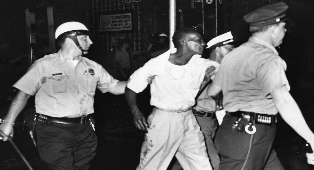 64riots A man ins arrested at 22nd Street and Columbia Avenue. (Courtesy of Temple University Libraries, Urban Archives, George D. McDowell Philadelphia Evening Bulletin Photographs Collection)